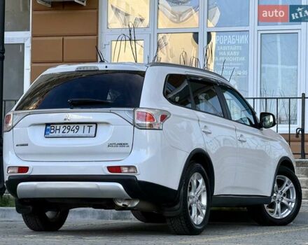 Белый Мицубиси Аутлендер, объемом двигателя 2.36 л и пробегом 140 тыс. км за 12999 $, фото 1 на Automoto.ua