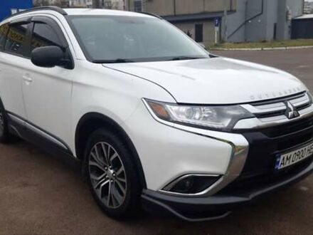 Белый Мицубиси Аутлендер, объемом двигателя 2.4 л и пробегом 240 тыс. км за 14900 $, фото 1 на Automoto.ua