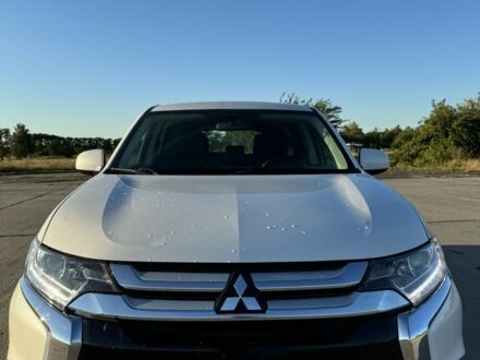 Белый Мицубиси Аутлендер, объемом двигателя 2.4 л и пробегом 91 тыс. км за 15900 $, фото 1 на Automoto.ua