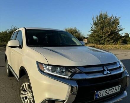 Белый Мицубиси Аутлендер, объемом двигателя 2.4 л и пробегом 91 тыс. км за 14900 $, фото 1 на Automoto.ua