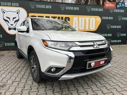 Белый Мицубиси Аутлендер, объемом двигателя 2.36 л и пробегом 153 тыс. км за 15700 $, фото 1 на Automoto.ua