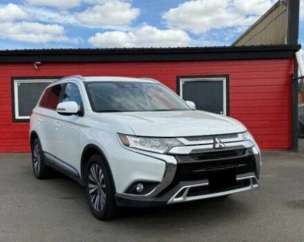 Белый Мицубиси Аутлендер, объемом двигателя 2.4 л и пробегом 65 тыс. км за 9500 $, фото 1 на Automoto.ua