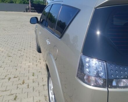 Бежевий Міцубісі Аутлендер, об'ємом двигуна 2.4 л та пробігом 257 тис. км за 8700 $, фото 4 на Automoto.ua
