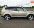 Бежевий Міцубісі Аутлендер, об'ємом двигуна 2.36 л та пробігом 207 тис. км за 10800 $, фото 20 на Automoto.ua
