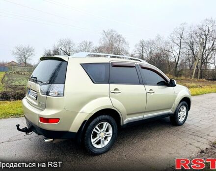 Бежевый Мицубиси Аутлендер, объемом двигателя 2.4 л и пробегом 107 тыс. км за 9900 $, фото 2 на Automoto.ua