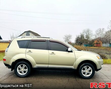 Бежевый Мицубиси Аутлендер, объемом двигателя 2.4 л и пробегом 107 тыс. км за 9900 $, фото 1 на Automoto.ua