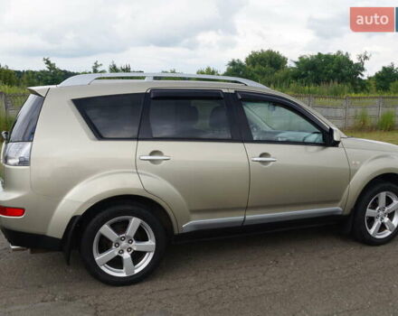 Бежевий Міцубісі Аутлендер, об'ємом двигуна 2.36 л та пробігом 207 тис. км за 10800 $, фото 19 на Automoto.ua