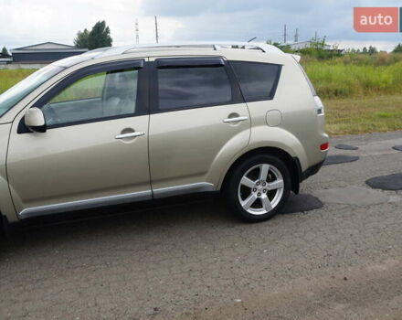 Бежевий Міцубісі Аутлендер, об'ємом двигуна 2.36 л та пробігом 207 тис. км за 10800 $, фото 8 на Automoto.ua