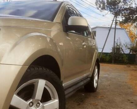 Бежевий Міцубісі Аутлендер, об'ємом двигуна 2.36 л та пробігом 240 тис. км за 9250 $, фото 4 на Automoto.ua