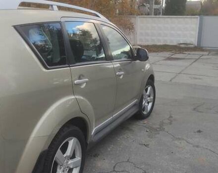 Бежевий Міцубісі Аутлендер, об'ємом двигуна 2.36 л та пробігом 190 тис. км за 9700 $, фото 4 на Automoto.ua