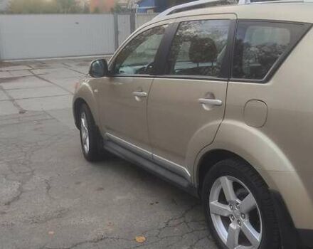 Бежевий Міцубісі Аутлендер, об'ємом двигуна 2.36 л та пробігом 190 тис. км за 9700 $, фото 5 на Automoto.ua