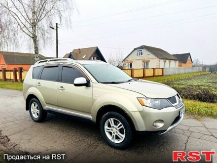 Бежевый Мицубиси Аутлендер, объемом двигателя 2.4 л и пробегом 107 тыс. км за 9900 $, фото 1 на Automoto.ua