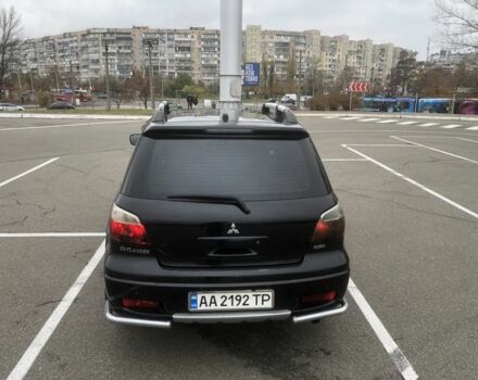 Чорний Міцубісі Аутлендер, об'ємом двигуна 2.4 л та пробігом 314 тис. км за 5000 $, фото 1 на Automoto.ua