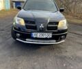 Чорний Міцубісі Аутлендер, об'ємом двигуна 2.4 л та пробігом 300 тис. км за 7500 $, фото 1 на Automoto.ua