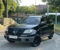 Чорний Міцубісі Аутлендер, об'ємом двигуна 2 л та пробігом 320 тис. км за 5428 $, фото 1 на Automoto.ua