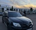 Черный Мицубиси Аутлендер, объемом двигателя 2.4 л и пробегом 280 тыс. км за 5300 $, фото 1 на Automoto.ua
