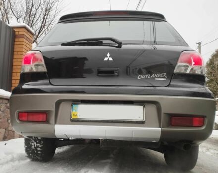 Чорний Міцубісі Аутлендер, об'ємом двигуна 2 л та пробігом 251 тис. км за 4990 $, фото 9 на Automoto.ua