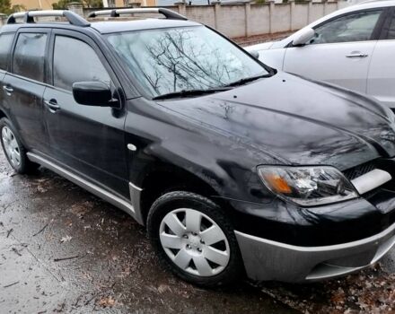 Чорний Міцубісі Аутлендер, об'ємом двигуна 2 л та пробігом 251 тис. км за 4990 $, фото 18 на Automoto.ua