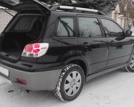 Чорний Міцубісі Аутлендер, об'ємом двигуна 2 л та пробігом 251 тис. км за 4990 $, фото 13 на Automoto.ua