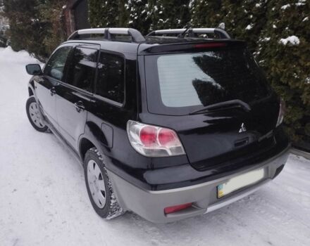 Чорний Міцубісі Аутлендер, об'ємом двигуна 2 л та пробігом 251 тис. км за 4990 $, фото 6 на Automoto.ua