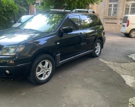 Черный Мицубиси Аутлендер, объемом двигателя 2.4 л и пробегом 312 тыс. км за 6500 $, фото 5 на Automoto.ua