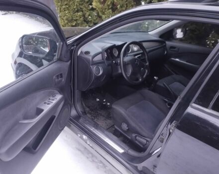 Чорний Міцубісі Аутлендер, об'ємом двигуна 2 л та пробігом 251 тис. км за 4990 $, фото 14 на Automoto.ua