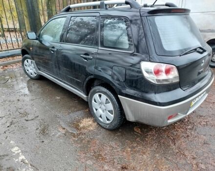 Чорний Міцубісі Аутлендер, об'ємом двигуна 2 л та пробігом 251 тис. км за 4990 $, фото 16 на Automoto.ua