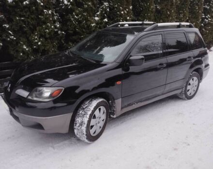 Чорний Міцубісі Аутлендер, об'ємом двигуна 2 л та пробігом 251 тис. км за 4990 $, фото 7 на Automoto.ua