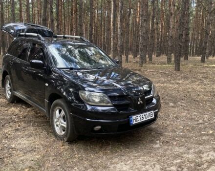 Черный Мицубиси Аутлендер, объемом двигателя 2.4 л и пробегом 312 тыс. км за 6500 $, фото 3 на Automoto.ua