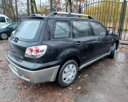 Чорний Міцубісі Аутлендер, об'ємом двигуна 2 л та пробігом 251 тис. км за 4990 $, фото 19 на Automoto.ua