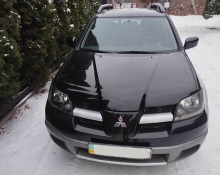 Чорний Міцубісі Аутлендер, об'ємом двигуна 2 л та пробігом 251 тис. км за 4990 $, фото 10 на Automoto.ua
