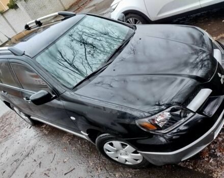 Чорний Міцубісі Аутлендер, об'ємом двигуна 2 л та пробігом 251 тис. км за 4990 $, фото 17 на Automoto.ua