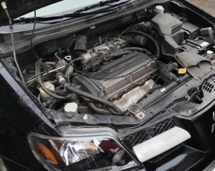 Чорний Міцубісі Аутлендер, об'ємом двигуна 2 л та пробігом 251 тис. км за 4990 $, фото 15 на Automoto.ua