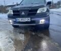 Черный Мицубиси Аутлендер, объемом двигателя 2.4 л и пробегом 226 тыс. км за 4500 $, фото 1 на Automoto.ua