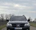 Чорний Міцубісі Аутлендер, об'ємом двигуна 2 л та пробігом 230 тис. км за 6300 $, фото 1 на Automoto.ua