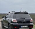 Чорний Міцубісі Аутлендер, об'ємом двигуна 2 л та пробігом 230 тис. км за 6300 $, фото 1 на Automoto.ua