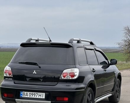 Чорний Міцубісі Аутлендер, об'ємом двигуна 2 л та пробігом 230 тис. км за 6300 $, фото 2 на Automoto.ua