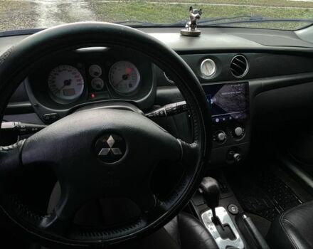 Черный Мицубиси Аутлендер, объемом двигателя 2.4 л и пробегом 200 тыс. км за 5800 $, фото 6 на Automoto.ua