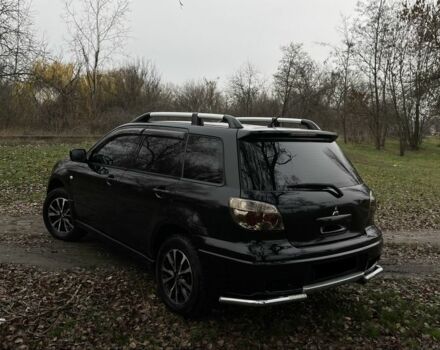 Черный Мицубиси Аутлендер, объемом двигателя 2.4 л и пробегом 200 тыс. км за 5800 $, фото 4 на Automoto.ua