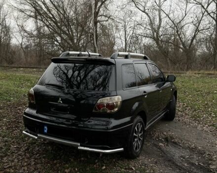 Черный Мицубиси Аутлендер, объемом двигателя 2.4 л и пробегом 200 тыс. км за 5800 $, фото 3 на Automoto.ua