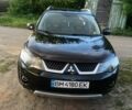 Чорний Міцубісі Аутлендер, об'ємом двигуна 2.4 л та пробігом 176 тис. км за 9500 $, фото 1 на Automoto.ua