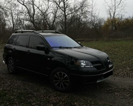 Черный Мицубиси Аутлендер, объемом двигателя 2.4 л и пробегом 200 тыс. км за 5800 $, фото 2 на Automoto.ua