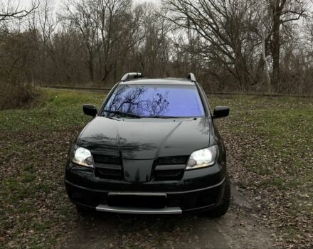 Черный Мицубиси Аутлендер, объемом двигателя 2.4 л и пробегом 200 тыс. км за 5800 $, фото 1 на Automoto.ua