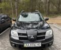 Черный Мицубиси Аутлендер, объемом двигателя 2.4 л и пробегом 192 тыс. км за 7600 $, фото 1 на Automoto.ua