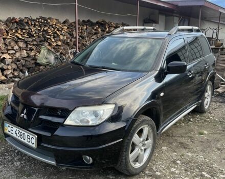 Черный Мицубиси Аутлендер, объемом двигателя 2 л и пробегом 156 тыс. км за 4200 $, фото 14 на Automoto.ua