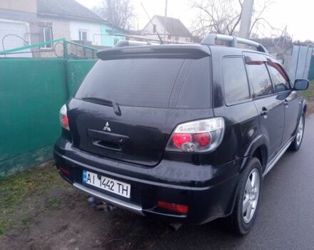 Чорний Міцубісі Аутлендер, об'ємом двигуна 2 л та пробігом 220 тис. км за 5599 $, фото 1 на Automoto.ua