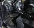 Черный Мицубиси Аутлендер, объемом двигателя 2.4 л и пробегом 270 тыс. км за 8629 $, фото 1 на Automoto.ua