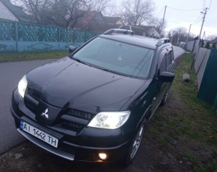 Чорний Міцубісі Аутлендер, об'ємом двигуна 2 л та пробігом 220 тис. км за 5599 $, фото 2 на Automoto.ua