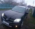 Чорний Міцубісі Аутлендер, об'ємом двигуна 2 л та пробігом 220 тис. км за 5599 $, фото 2 на Automoto.ua
