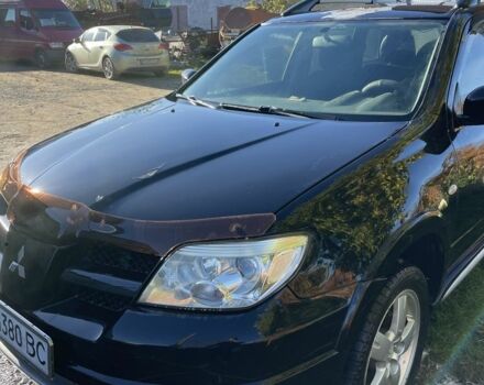 Черный Мицубиси Аутлендер, объемом двигателя 2 л и пробегом 156 тыс. км за 4200 $, фото 3 на Automoto.ua